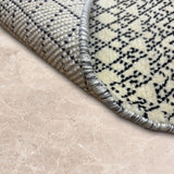 Siyahrekh – Hand Knotted Wool Rug in Black/Cream