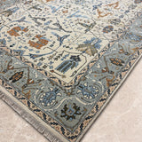 Safarnama – Hand Knotted Wool Rug in Cream/Grey