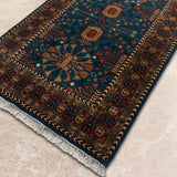 Neelvan – Hand Knotted Wool Rug in Turquoise Blue/Rust
