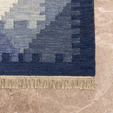 Indra Rekha – Hand Woven Wool Rug in Indigo/Cream