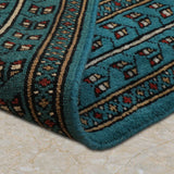 Kohistan – Hand Knotted Wool Rug in Turquoise Blue/Black