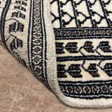 Kaarun - Hand Knotted Wool Rug in Ivory/Black
