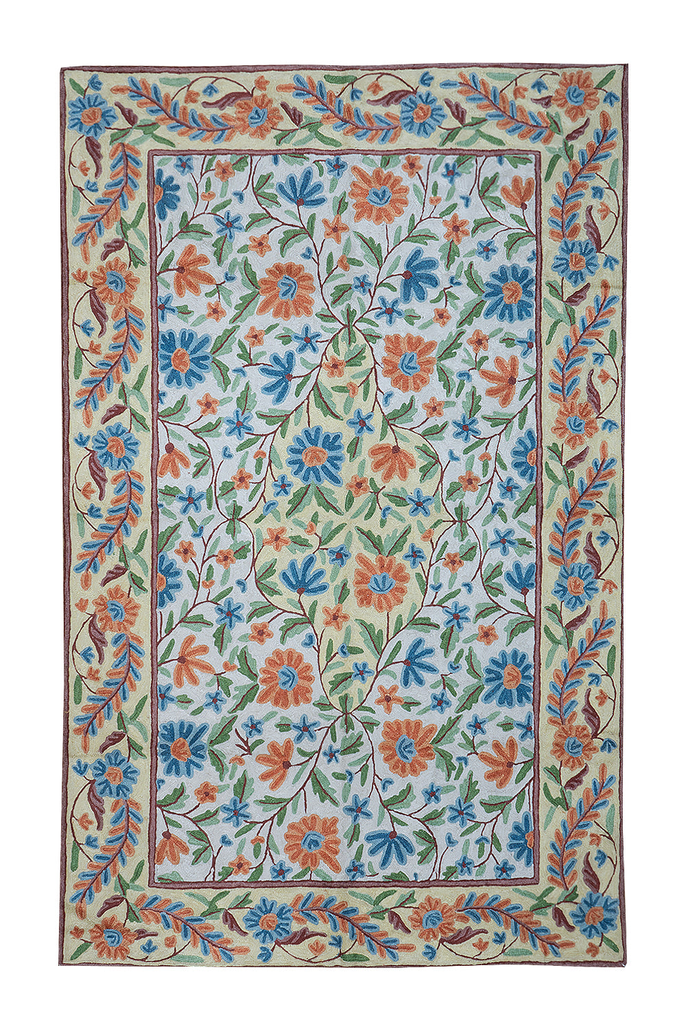 Gulmarg handmade floral rug with chain stitch embroidery in cream and light blue, featuring vibrant orange and blue flowers with green leaves on a soft cotton base.