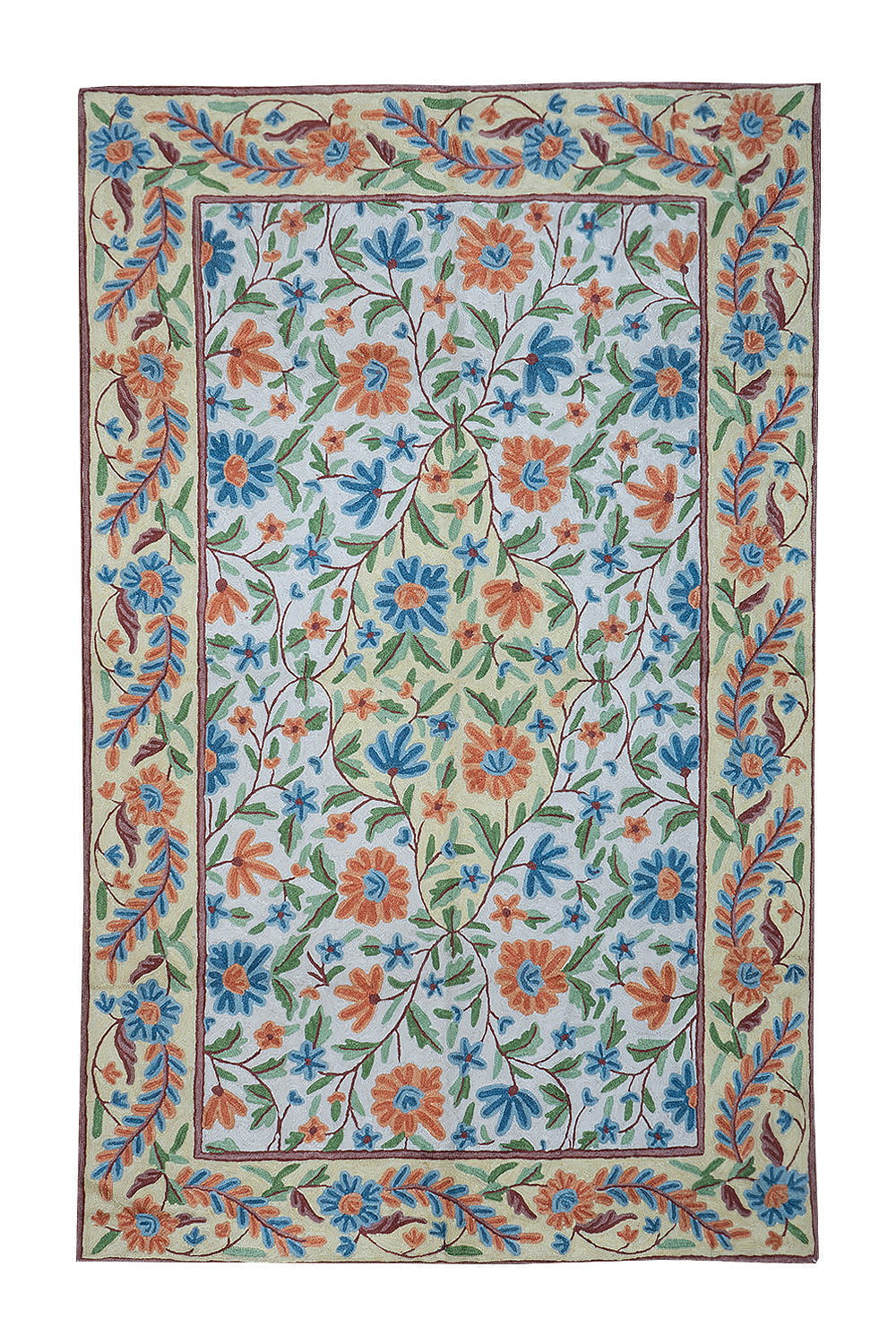 Gulmarg handmade floral rug with chain stitch embroidery in cream and light blue, featuring vibrant orange and blue flowers with green leaves on a soft cotton base.