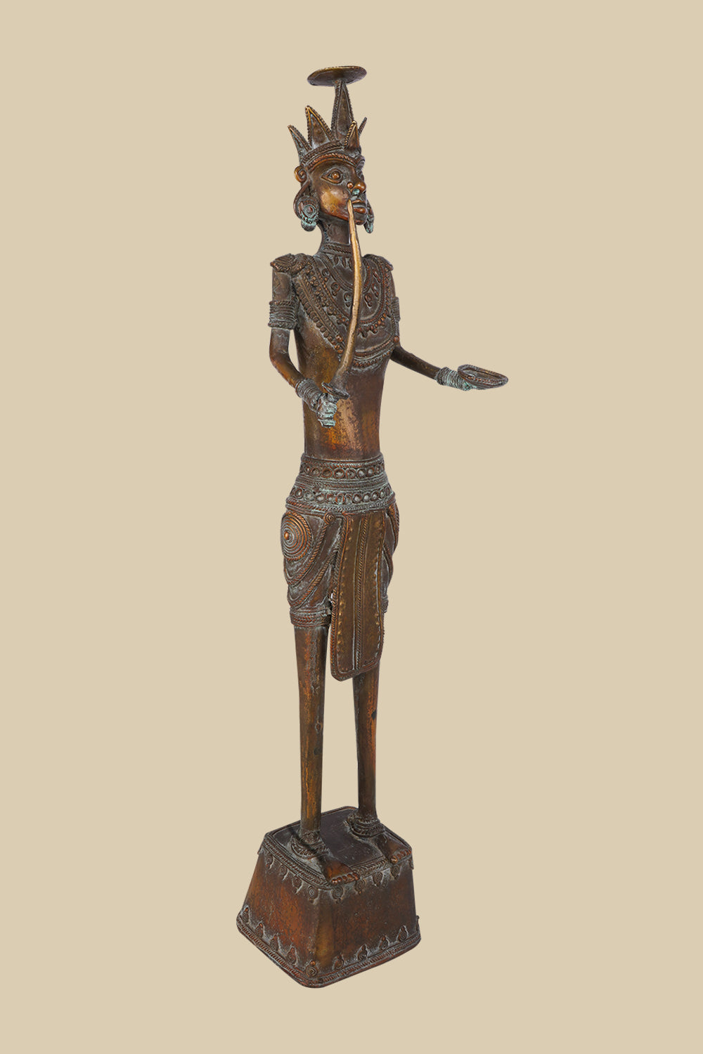 Antique-style dark brass statue of a soldier holding a sword pointing upwards and with an open palm extended, wearing textured armor and a distinctive headdress, standing on a tiered base.