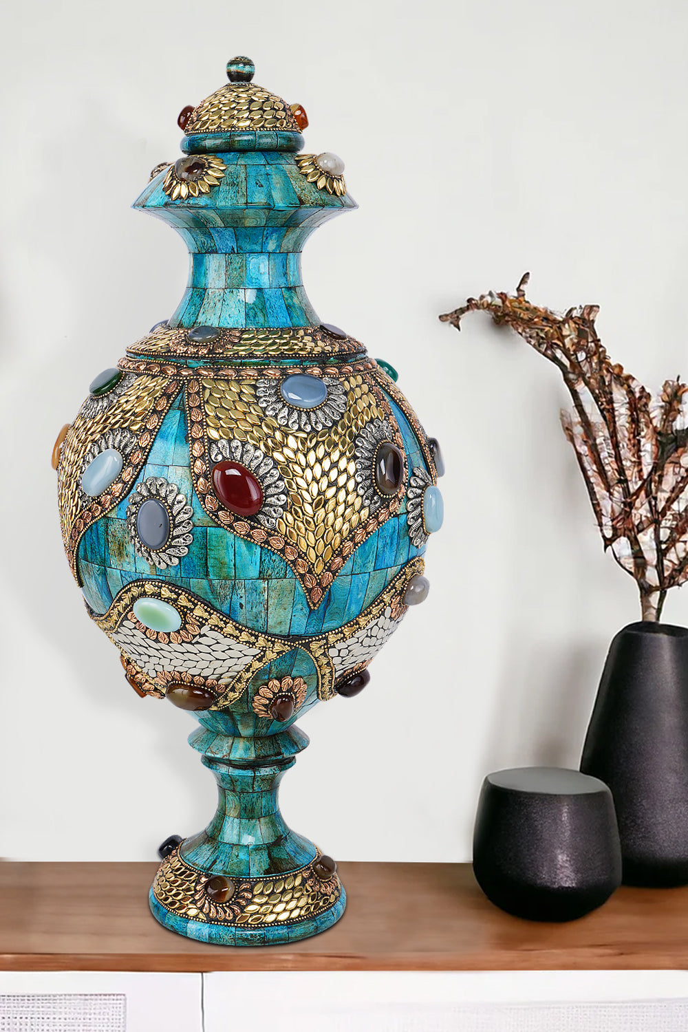 Ornate azure Surahi vase crafted from camel bone with intricate gold-toned metalwork and colorful semi-precious stone embellishments.