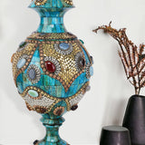 Ornate azure Surahi vase crafted from camel bone with intricate gold-toned metalwork and colorful semi-precious stone embellishments.