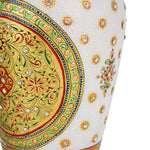 Close-up view of a white marble vase showcasing intricate hand-painted floral and geometric designs in rich blues, reds, and greens, heavily accented with gold and embedded with small, clear gemstones. The detail highlights the craftsmanship of the painting and the jewel-like embellishments.