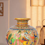 Round marble vase meticulously hand-painted with a vibrant depiction of Lord Krishna dancing with gopis and peacocks, featuring intricate traditional Indian motifs and a decorative neck.