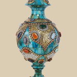 Lidded azure Surahi vase crafted from camel bone featuring intricate gold-toned metalwork and colorful semi-precious stone accents.