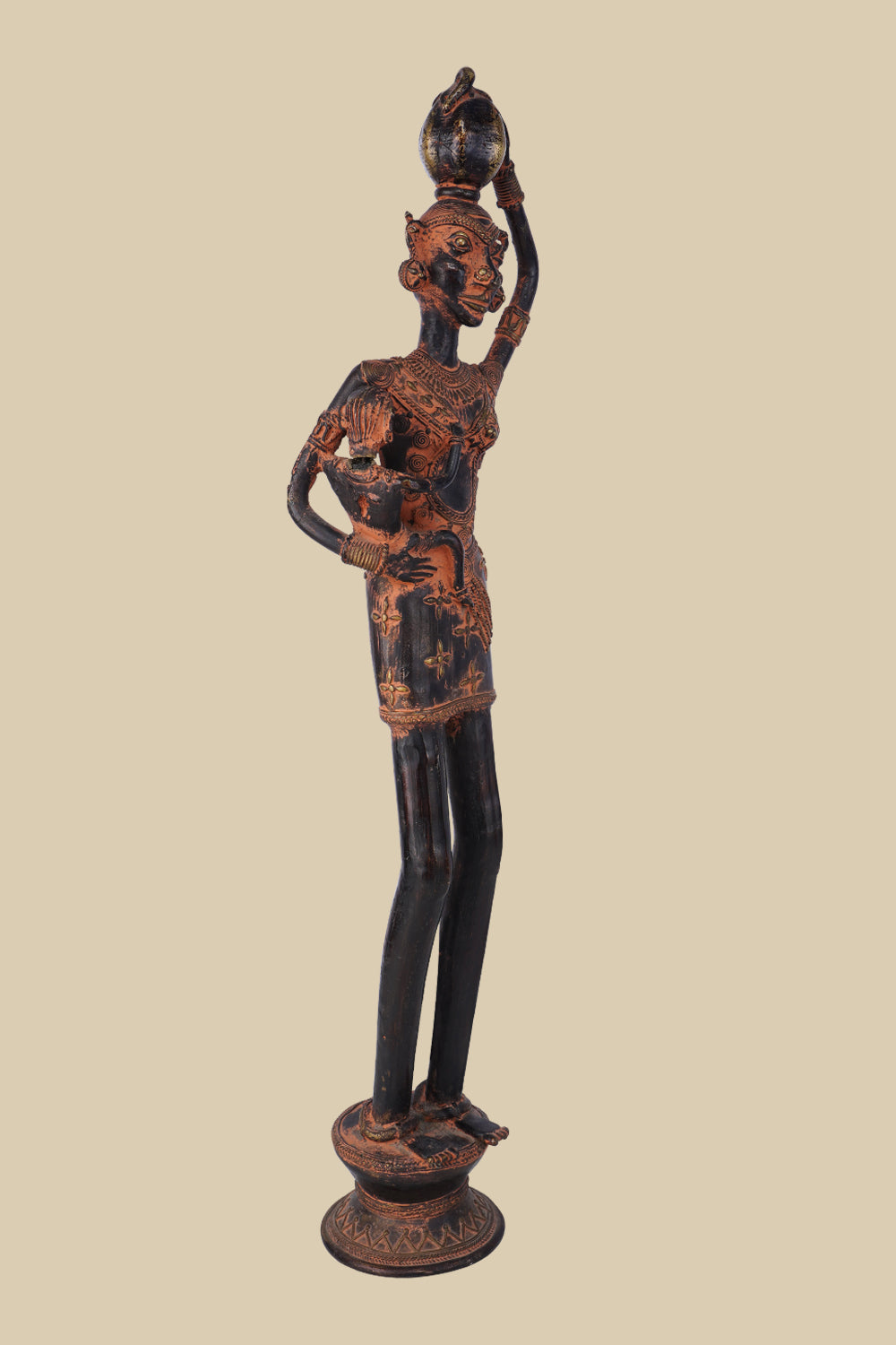 Antique-style dark brass sculpture of a village woman carrying a child on her hip and a water pot balanced on her head, showcasing traditional tribal art and standing on a detailed circular base.