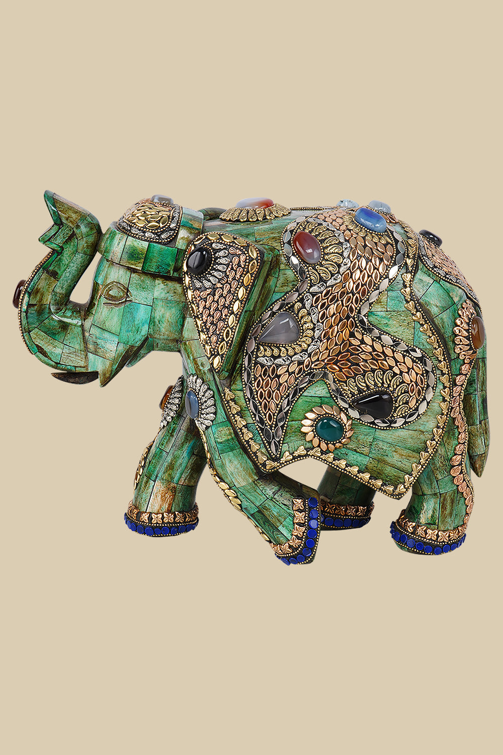Regal green camel bone elephant sculpture intricately decorated with gold-toned metalwork and colorful gemstone inlays, showcasing traditional Indian craftsmanship