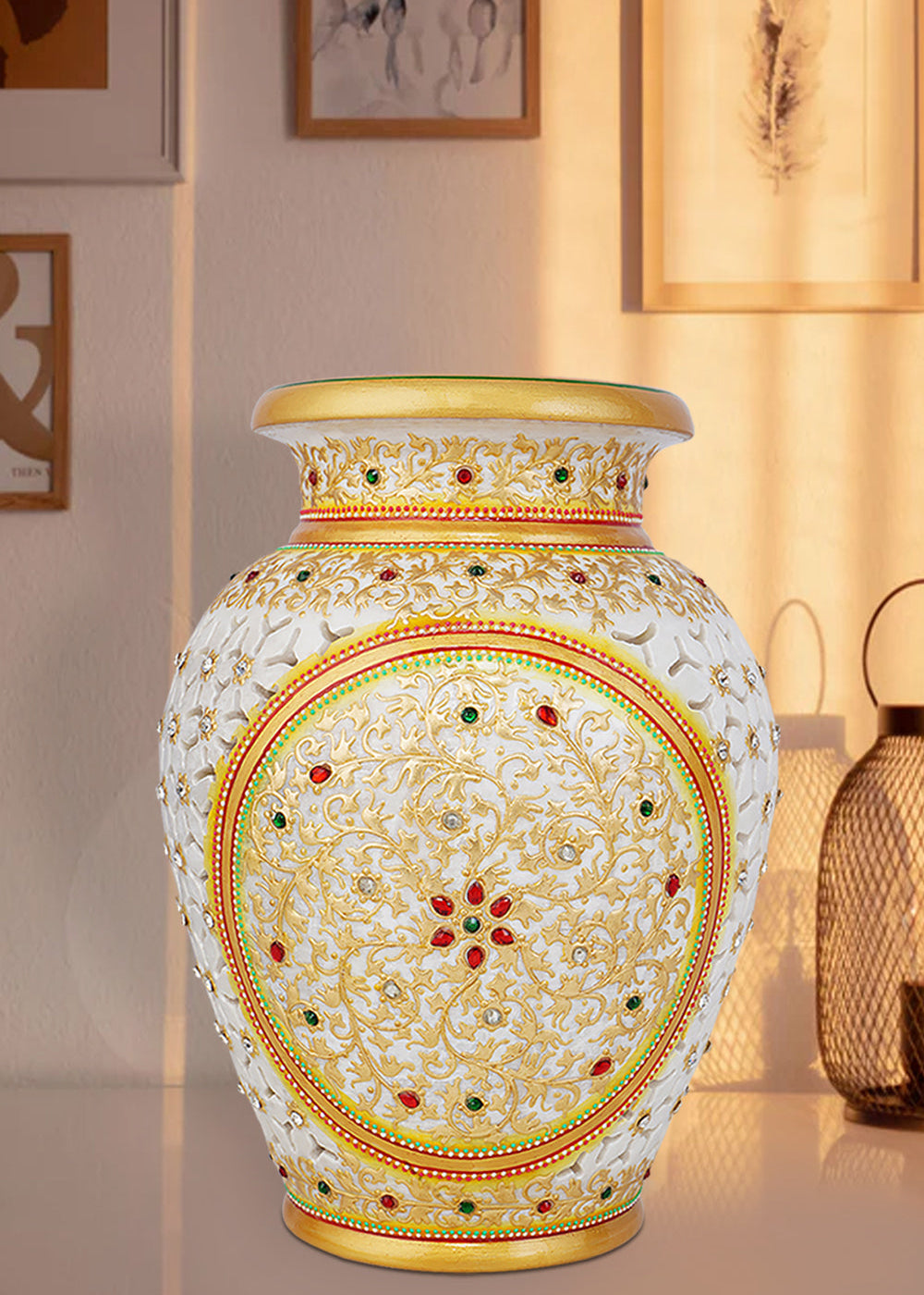 Elegant white marble vase with intricate undercut detailing, hand-painted with colorful floral patterns, accented with gold highlights and embedded red and green stonework.